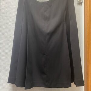 Black pleated knee- length skirt